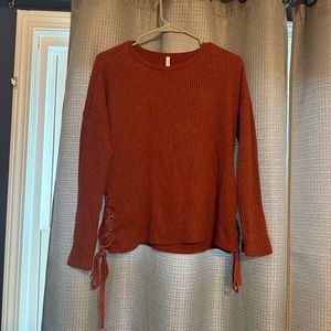 Sweater with tie sides